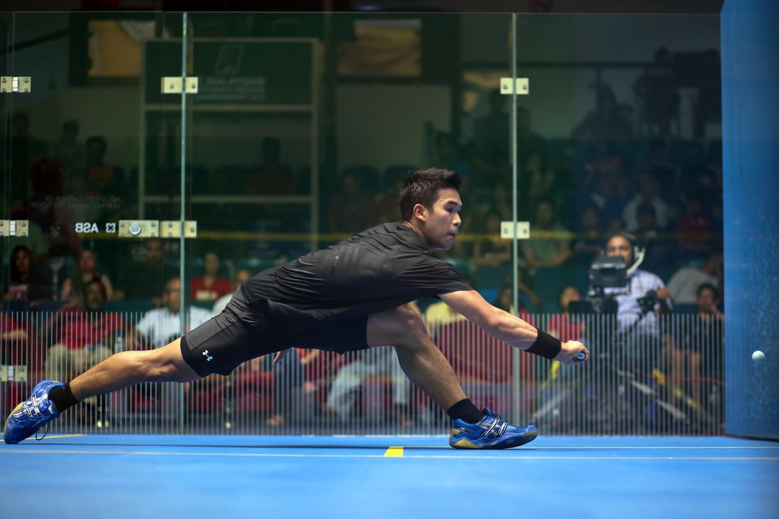 Big lunge on backhand side on glass court (No 111937124)